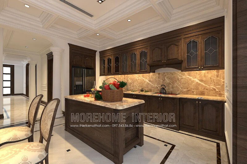 Thiết kế tủ bếp gỗ óc chó tân cổ điển kết hợp bàn đảo cùng chất liệu được đặt chính giữa tạo sự cân bằng cho không gian cũng như tiện nghi hơn cho người nội trợ Tủ bếp