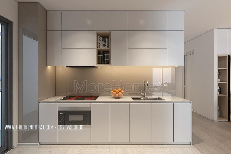 Mẫu tủ bếp kiểu dáng chữ i gỗ công nghiệp màu trắng kết hợp phân chia các ngăn tủ một cách hợp lí, tạo cho người nội trợ thuận tiện hơn trong quá trình mang lại những bữa cơm ngon miệng cho những người thân yêu của mình Tủ bếp hiện đại