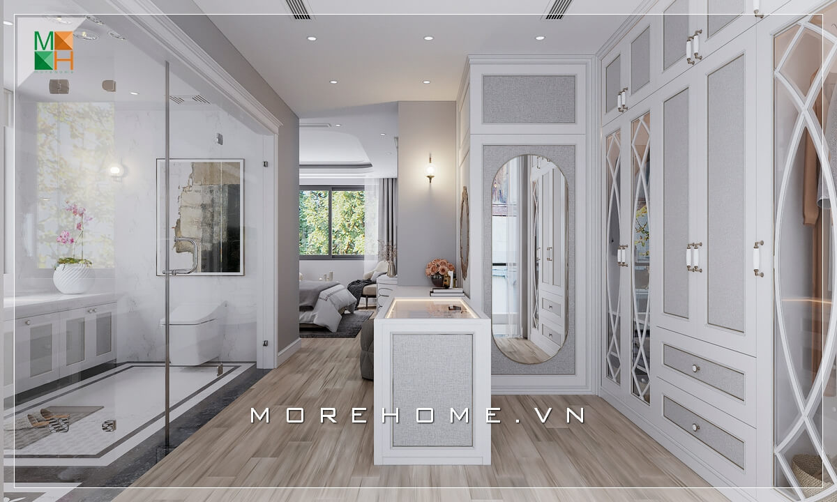 Morehome xin giới thiệu cho bạn mẫu phòng ngủ phong cách tân cổ điển với phòng thay đồ ở trung tâm giúp liên kết không gian phòng ngủ với phòng tắm, tận dụng triệt để diện tích sử dụng và mang lại sự thuận tiện cho sinh hoạt hàng ngày. Mẫu nội thất biệt thự tân cổ điển